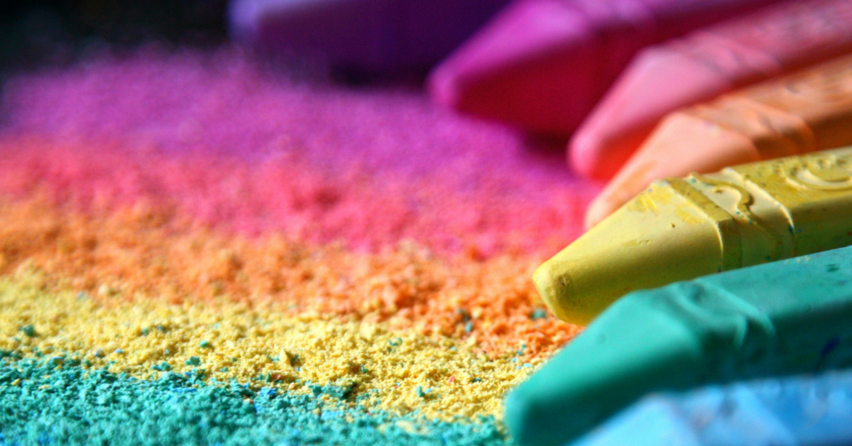 multi colored chalk spread out with a trail of chalk dust depicting color psychology