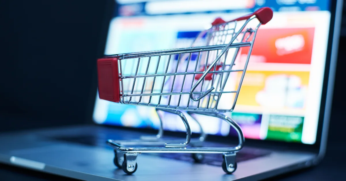 Shopping cart on a laptop screen representing Advertising in Ecommerce and online product promotions.